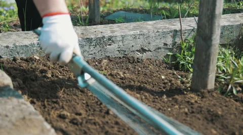 Work on the Ground With a Rake Stock Footage 62207960