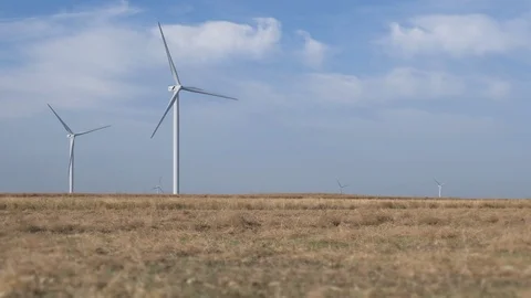 Work of the group of wind power. Wind power generator installed in the field. Stock Footage 120033085