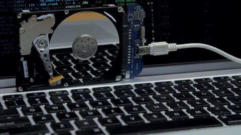Work of hacked hard drive inside. Lines of code and data flash in monitor Stock Footage 132657447