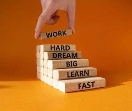 Work hard Dream big Learn fast symbol. Wooden blocks with words Work hard D.. Stock Photos