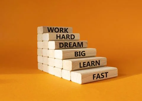 Work hard Dream big Learn fast symbol. Wooden blocks with words Work hard D.. Stock Photos