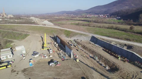 Work on a highway route with vehicles, machinery and workers working with th Stock Footage 330687128
