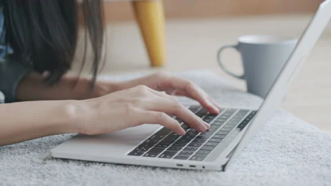 Work from home. Close-up Hand of young woman touching keyboard Stock Footage 136469428