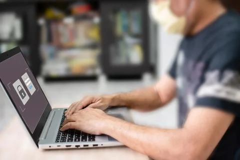 Work at home with computer and internet Laptop screen showing the login for.. Stock Photos