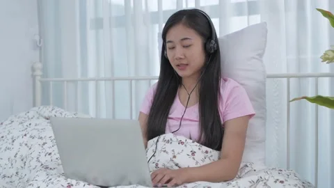 Work from home concept of 4k Resolution. Asian young woman communicating vide Stock Footage 144622310