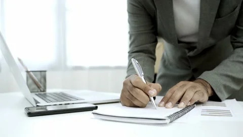 Work from home concept. Close up. Asian male business wear a suit work at home t Stock Footage 144515377