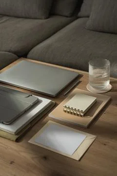 Work at home concept. Laptop computer, tablet pad, notebooks, paper sheets, g Stockfoto's