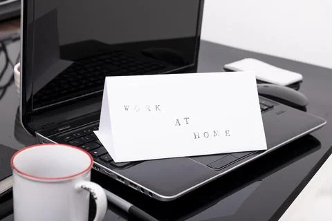 Work from home concept. Man working with a laptop during home quarantine to.. Stock Photos