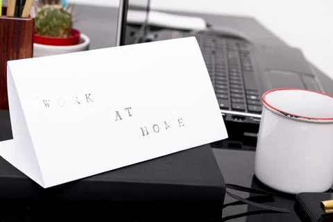 Work from home concept. Man working with a laptop during home quarantine to.. Stock Photos