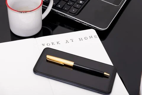 Work from home concept. Man working with a laptop during home quarantine to.. Stock Photos