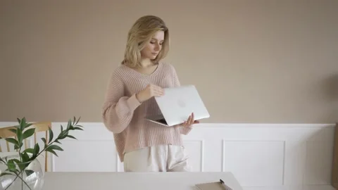 Work from home concept, Portrait of beautiful young woman working on laptop in Stock Footage 142211345