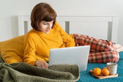 Work from home, distance learning, surfing Internet in morning after waking up. Stock Photos