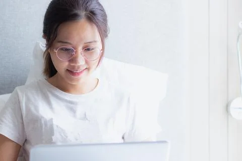 Work from home during the outbreak of the virus. Asian young woman working .. Stock Photos