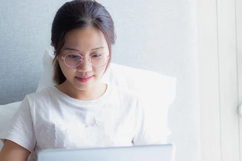 Work from home during the outbreak of the virus. Asian young woman working .. Stock Photos