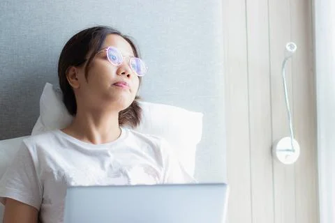 Work from home during the outbreak of the virus. Asian young woman seriousl.. Stock Photos
