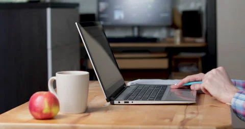 Work from home laptop and tea Stock Footage 156862352