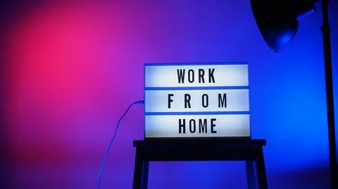 Work from home light box in studio. WFH Text on lightbox. Stock Photos