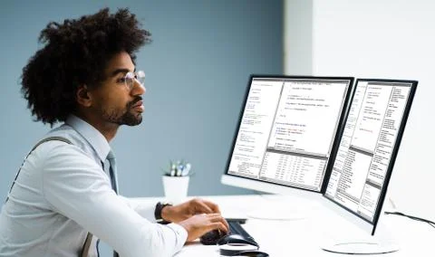 Work From Home On Multiple Computer Screen Stock Photos