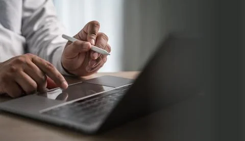 Work from home office use the internet working on laptop computer sitting a.. Stock Photos