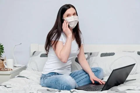 Work Home or Distance Online Learning on Quarantune. Woman in Protective Face Stock Photos