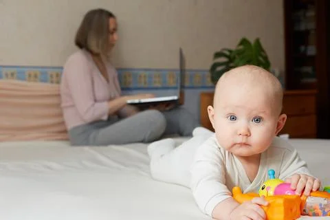 Work at home. Remote work with a small child Stock Photos