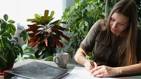 Work at home. young beautiful freelancer woman is working at the table Stock Footage 88193925