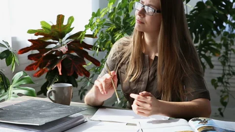 Work at home. young beautiful freelancer woman is working at the table Stock Footage 88195247