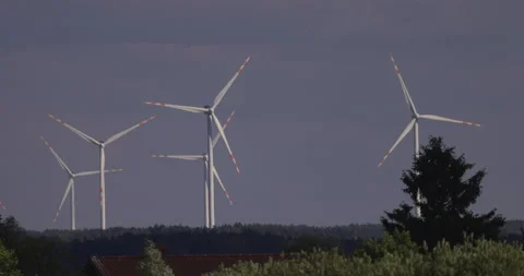 The work of huge windmills on a wind farm, 4K slomo Stock Footage 222165660