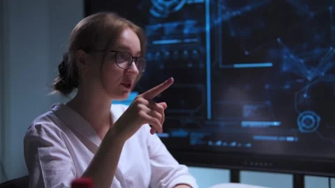 Work interview between a man and a woman sitting at a table in hightech Stock Footage 317165763