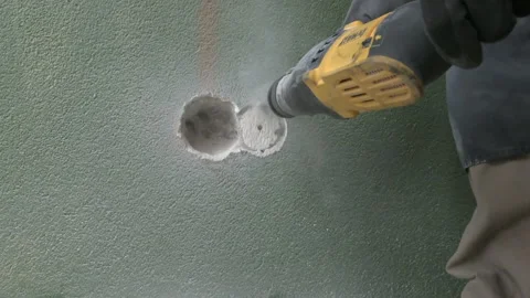 Work of a jackhammer. Drilling hole in concrete wall. Close Up. 스톡 동영상 177374869