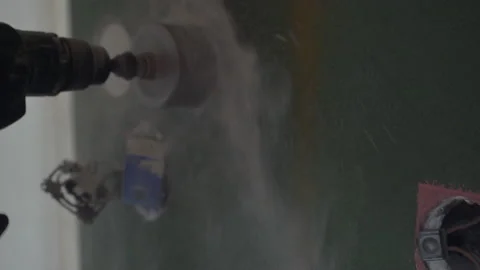 Work of a jackhammer. Drilling hole in concrete wall. Close Up. Stock Footage 178365881