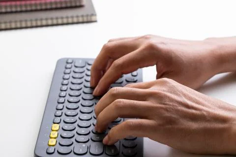 Work on the keyboard over the table Foto stock