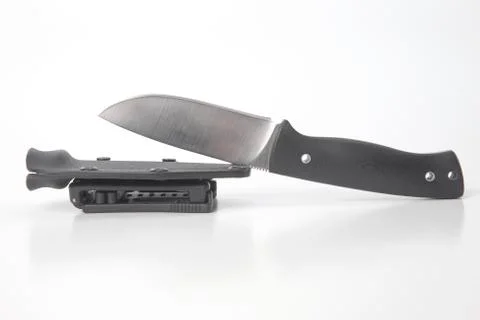 Work knife with a black handle and plastic sheath on a white background. cutt Stock Photos
