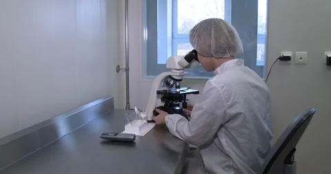 Work in the laboratory with a microscope Stock Footage 126705731