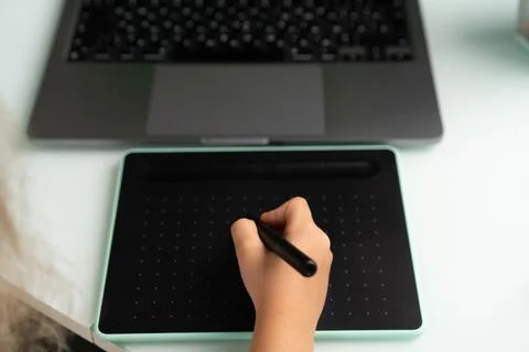 Work at a laptop and a graphics tablet Stock Photos