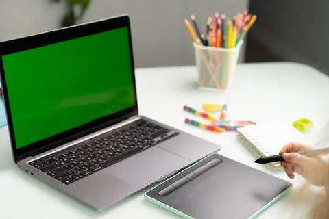 Work at a laptop and a graphics tablet Stock Photos