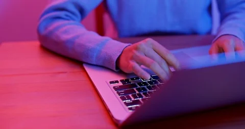 Work on laptop computer with purple light Stock Footage 100415648