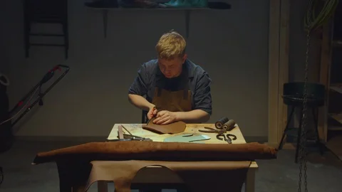 Work with leather and scissors. Stay home Stock Footage 127835661