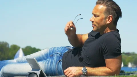 Work-life balance - working in the park and enjoying the weather Stock Footage 89631108