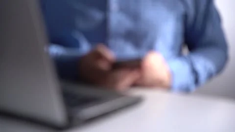Work in a Light Modern Office. Young Modern Man Holding a Smartphone. Stock Footage 150376863