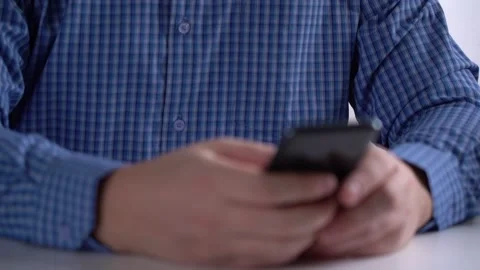 Work in a Light Modern Office. Young Modern Man Holding a Smartphone. Video stock 151463096
