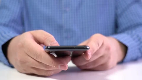 Work in a Light Modern Office. Young Modern Man Holding a Smartphone. Stock-Footage 152473011