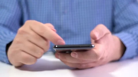 Work in a Light Modern Office. Young Modern Man Holding a Smartphone. Stock Footage 167886913