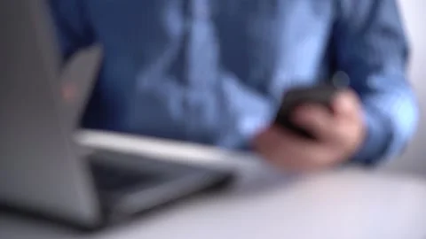 Work in a Light Modern Office. Young Modern Man Holding a Smartphone. Stock Footage 169092111
