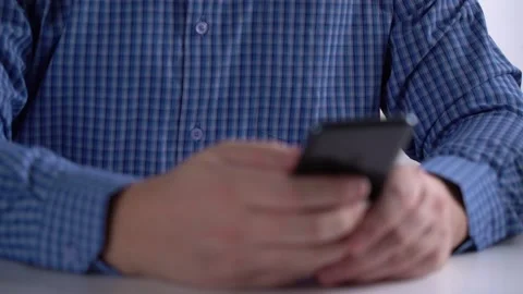 Work in a Light Modern Office. Young Modern Man Holding a Smartphone. Stock Footage 169092326