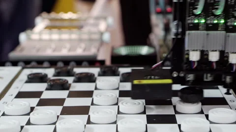 The work of the machine for placing checkers on the playing field. Stock-Footage 153650534
