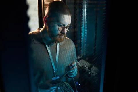 At Work Maintaining Network Cables in Data Center Stock Photos