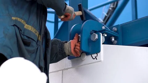 Work makes the installation of the equipment. Clip. Male worker assembles Stock Footage 102122360