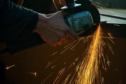 Work with a manual grinding machine Stock Photos