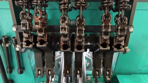 The work of the mechanical parts of the knitting machine Stock Footage 264960014